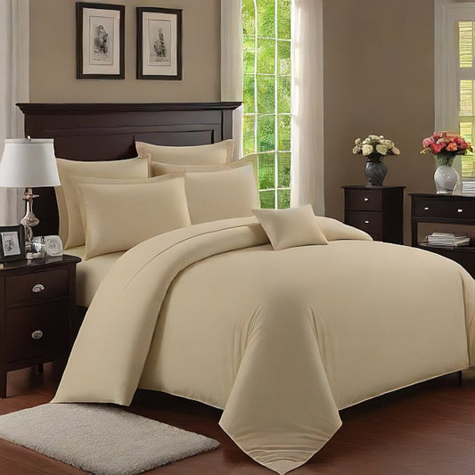 An ivory-colored Egyptian cotton duvet cover set displayed in a bedroom setting, including a duvet cover and pillow shams.