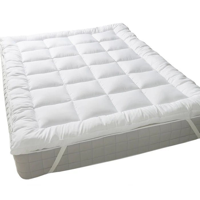 2-inch bamboo and cotton mattress topper on a bed